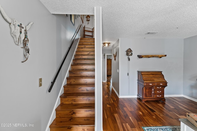 15 Ponte Vedra Ct Unit C, Ponte Vedra Beach, FL 32082 - stairway with wood finished floors, baseboards, and a textured ceiling