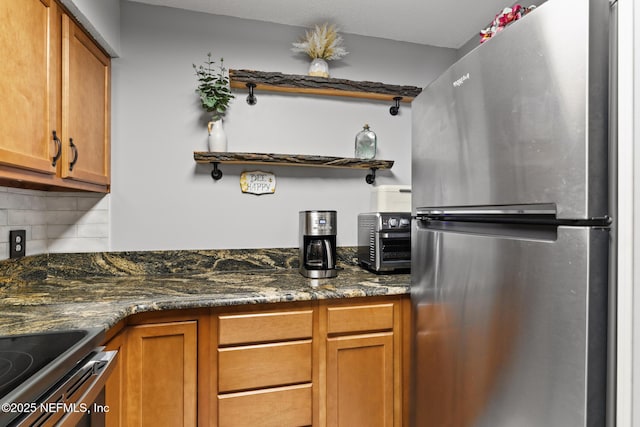 15 Ponte Vedra Ct Unit C, Ponte Vedra Beach, FL 32082 - kitchen with freestanding refrigerator, open shelves, decorative backsplash, and brown cabinets