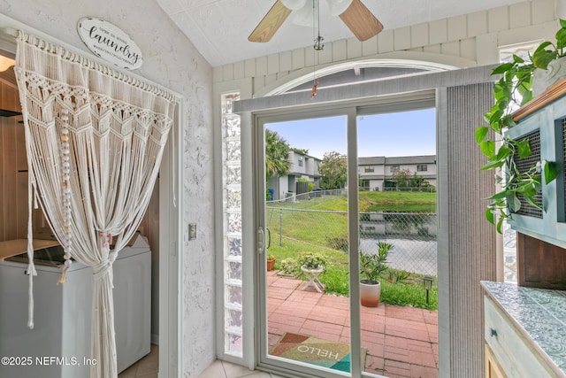 15 Ponte Vedra Ct Unit C, Ponte Vedra Beach, FL 32082 - doorway to outside with wallpapered walls, ceiling fan, and light tile patterned flooring