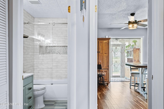 15 Ponte Vedra Ct Unit C, Ponte Vedra Beach, FL 32082 - bathroom featuring ceiling fan, toilet, vanity, shower / bath combination with glass door, and wood finished floors