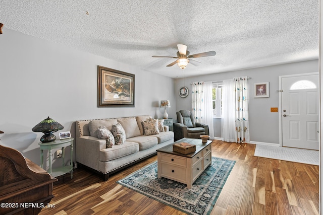 15 Ponte Vedra Ct Unit C, Ponte Vedra Beach, FL 32082 - living area featuring a ceiling fan, wood finished floors, a textured ceiling, and baseboards