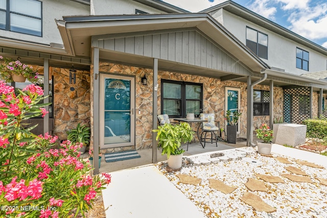 15 Ponte Vedra Ct Unit C, Ponte Vedra Beach, FL 32082 - entrance to property with stone siding, a porch, and stucco siding