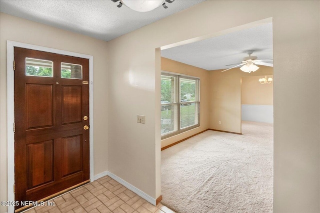 905 Ridgeway Ct, Orange Park, FL 32065 - foyer featuring baseboards, a textured ceiling, ceiling fan, and a chandelier