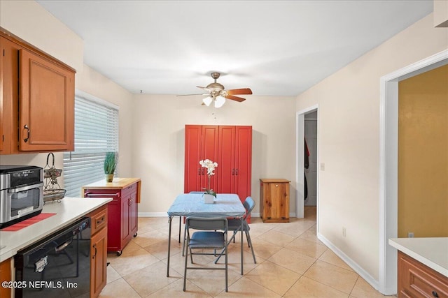 905 Ridgeway Ct, Orange Park, FL 32065 - dining space with a ceiling fan, baseboards, and light tile patterned flooring