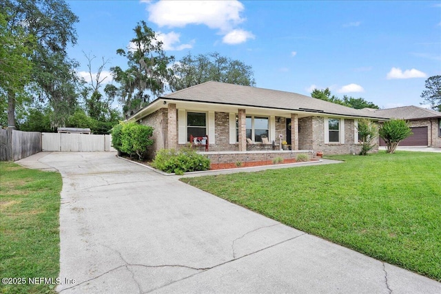 905 Ridgeway Ct, Orange Park, FL 32065 - ranch-style home featuring concrete driveway, brick siding, a gate, and a porch