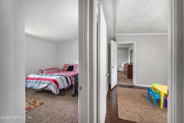 4357 Trenton Dr S, Jacksonville, FL 32209 - bedroom featuring wood finished floors, a textured ceiling, and baseboards