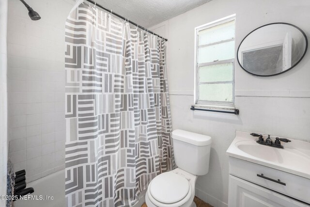 4357 Trenton Dr S, Jacksonville, FL 32209 - full bath featuring vanity, toilet, a textured ceiling, and shower / bath combo with shower curtain