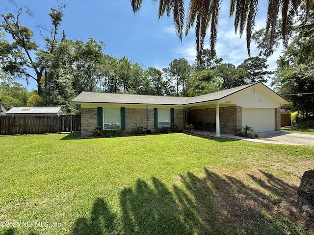 12753 Burning Tree Ln W, Jacksonville, FL 32223 - ranch-style house with brick siding, an attached garage, and concrete driveway