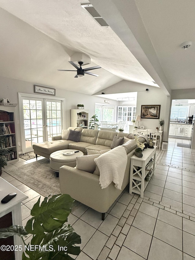 12753 Burning Tree Ln W, Jacksonville, FL 32223 - living area featuring lofted ceiling, a ceiling fan, and light tile patterned floors