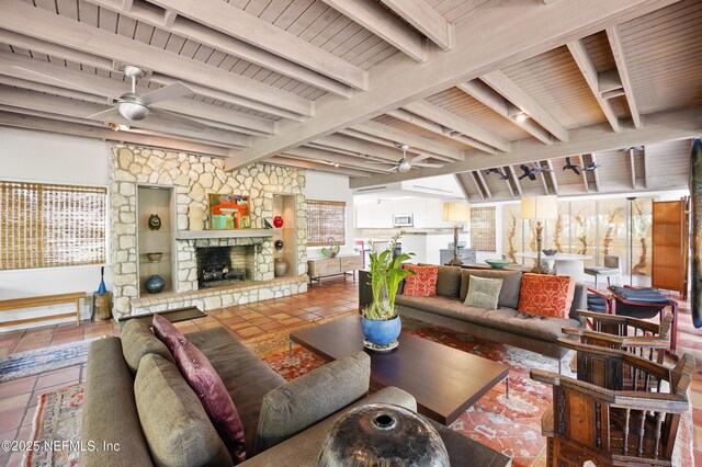 1927 Beachside Ct, Atlantic Beach, FL 32233 - tiled living area featuring a ceiling fan, wood ceiling with exposed beams, and a stone fireplace
