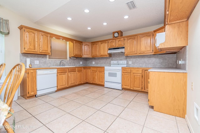 6645 Elvin Starling Rd, Macclenny, FL 32063 - kitchen with white appliances, under cabinet range hood, light countertops, backsplash, and recessed lighting