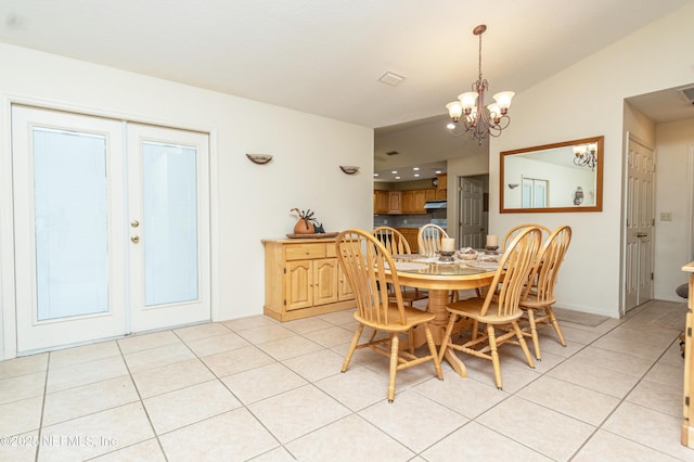 6645 Elvin Starling Rd, Macclenny, FL 32063 - dining room with light tile patterned floors, a chandelier, french doors, and baseboards