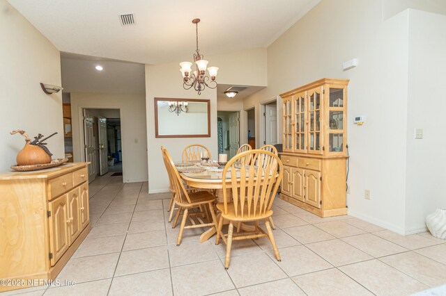 6645 Elvin Starling Rd, Macclenny, FL 32063 - dining room featuring a chandelier, light tile patterned floors, baseboards, vaulted ceiling, and recessed lighting