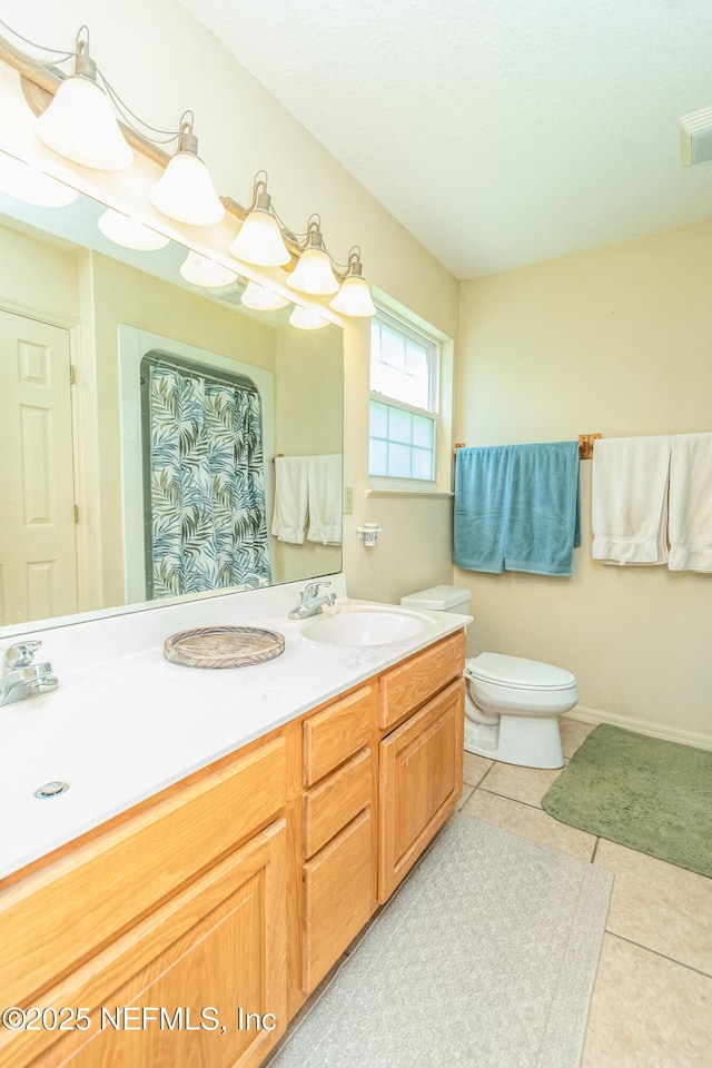 6645 Elvin Starling Rd, Macclenny, FL 32063 - full bath with tile patterned flooring, toilet, vanity, and a shower with curtain