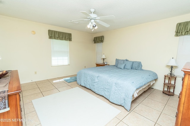 6645 Elvin Starling Rd, Macclenny, FL 32063 - bedroom with light tile patterned floors, baseboards, and ceiling fan