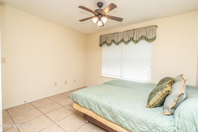 6645 Elvin Starling Rd, Macclenny, FL 32063 - bedroom featuring light tile patterned floors, baseboards, and ceiling fan