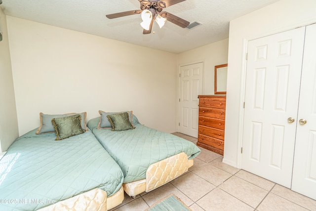 6645 Elvin Starling Rd, Macclenny, FL 32063 - bedroom with light tile patterned flooring and a ceiling fan