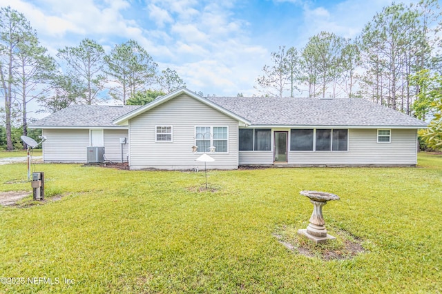 6645 Elvin Starling Rd, Macclenny, FL 32063 - back of house featuring a lawn, a shingled roof, central air condition unit, and a sunroom