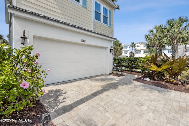2695 Morning Light Ct, Flagler Beach, FL 32136 - garage with decorative driveway
