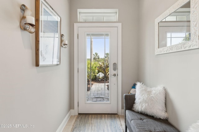 2695 Morning Light Ct, Flagler Beach, FL 32136 - doorway to outside with baseboards and light wood finished floors