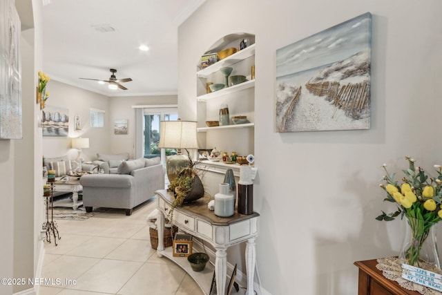 2695 Morning Light Ct, Flagler Beach, FL 32136 - living area with crown molding, ceiling fan, and light tile patterned floors