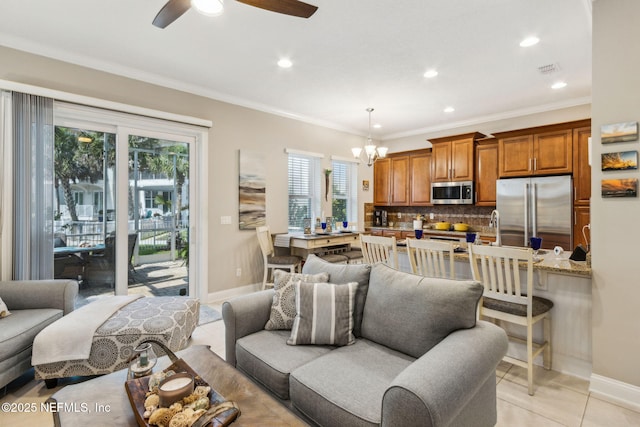 2695 Morning Light Ct, Flagler Beach, FL 32136 - living room with light tile patterned flooring, a chandelier, baseboards, ceiling fan, and recessed lighting
