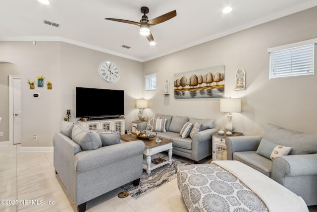 2695 Morning Light Ct, Flagler Beach, FL 32136 - living area featuring arched walkways, a ceiling fan, light tile patterned floors, ornamental molding, and baseboards
