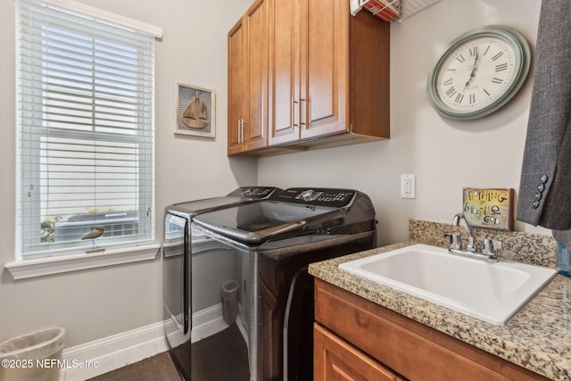 2695 Morning Light Ct, Flagler Beach, FL 32136 - laundry room with independent washer and dryer, cabinet space, and baseboards
