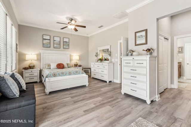 2695 Morning Light Ct, Flagler Beach, FL 32136 - bedroom featuring light wood-style floors, ornamental molding, baseboards, and ceiling fan