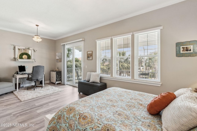 2695 Morning Light Ct, Flagler Beach, FL 32136 - bedroom featuring access to outside, an office area, wood finished floors, ornamental molding, and baseboards