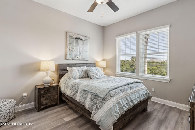 2695 Morning Light Ct, Flagler Beach, FL 32136 - bedroom featuring baseboards, wood finished floors, and ceiling fan