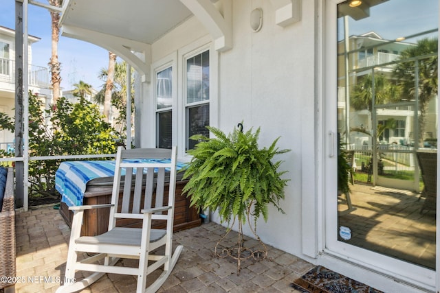 2695 Morning Light Ct, Flagler Beach, FL 32136 - sunroom featuring arched walkways
