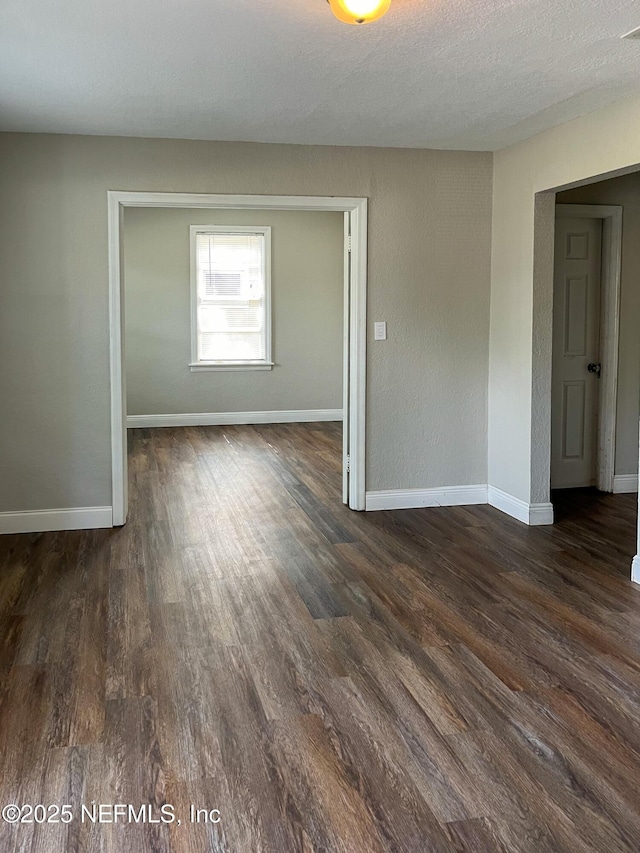 4522 Kingsbury St, Jacksonville, FL 32205 - unfurnished room with dark wood-style floors and baseboards