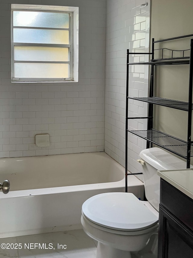 4522 Kingsbury St, Jacksonville, FL 32205 - bathroom featuring a tub to relax in, vanity, toilet, and marble look tile flooring