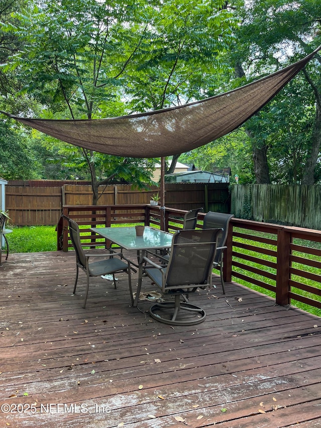 4522 Kingsbury St, Jacksonville, FL 32205 - wooden terrace with a fenced backyard and outdoor dining space
