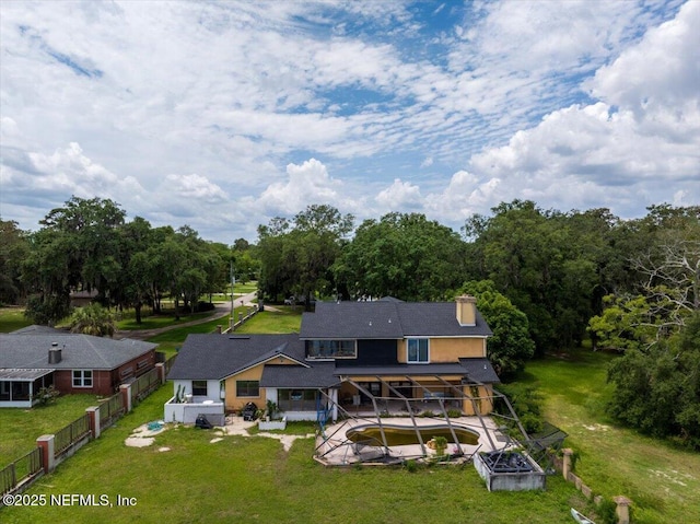8063 Appian Way, Jacksonville, FL 32208 - rear view of property featuring a patio area, an outdoor pool, a chimney, and stucco siding