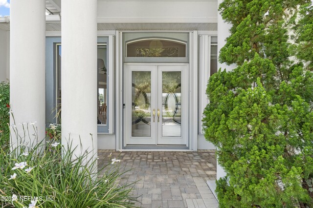 12 Collingville Ct, Palm Coast, FL 32137 - doorway to property with french doors