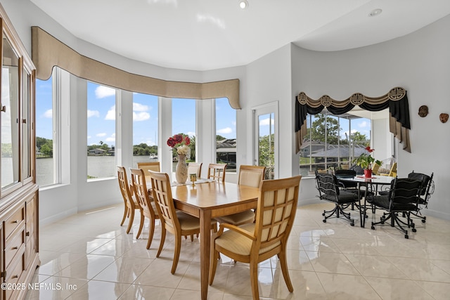 12 Collingville Ct, Palm Coast, FL 32137 - dining room featuring healthy amount of natural light, baseboards, and light tile patterned floors
