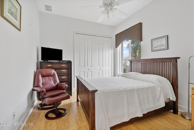 12 Collingville Ct, Palm Coast, FL 32137 - bedroom featuring a closet, light wood-style floors, baseboards, and ceiling fan