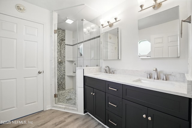 1205 Eagle Bend Ct, Jacksonville, FL 32226 - bathroom with a stall shower, double vanity, and wood finished floors