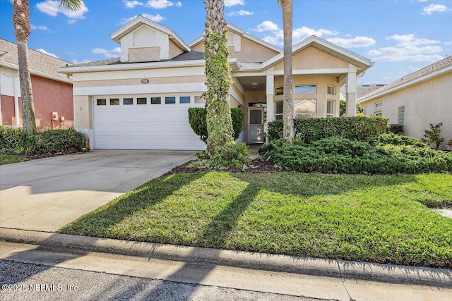 256 Kingston Dr, Saint Augustine, FL 32084 - view of front of house with stucco siding, an attached garage, driveway, and a front yard