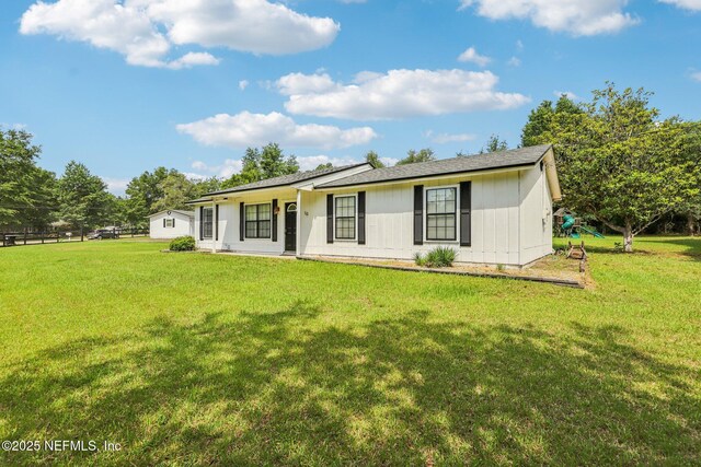 10 Sesame St, Middleburg, FL 32068 - back of house featuring a lawn
