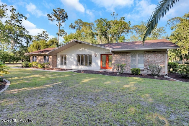 10859 Windy Gale Dr W, Jacksonville, FL 32218 - view of front of home with a front lawn and brick siding