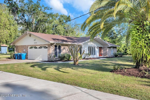 10859 Windy Gale Dr W, Jacksonville, FL 32218 - single story home with a garage, concrete driveway, brick siding, and a front yard