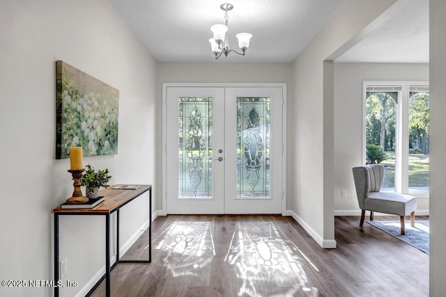 10859 Windy Gale Dr W, Jacksonville, FL 32218 - entryway featuring french doors, healthy amount of natural light, and a chandelier