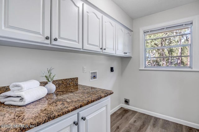 10859 Windy Gale Dr W, Jacksonville, FL 32218 - washroom with cabinet space, washer hookup, baseboards, and wood finished floors