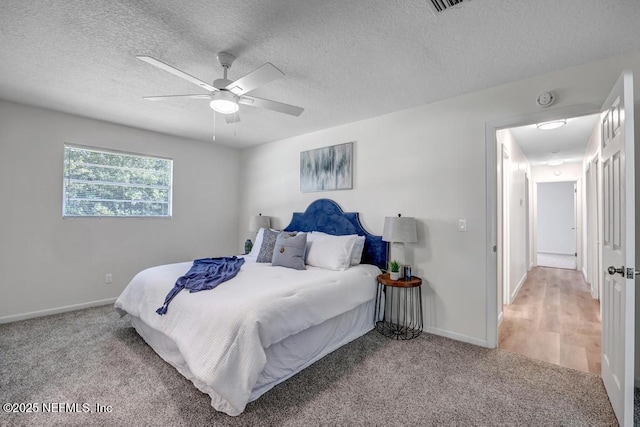 10859 Windy Gale Dr W, Jacksonville, FL 32218 - bedroom featuring carpet flooring, baseboards, a textured ceiling, and a ceiling fan