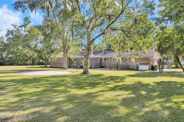 10859 Windy Gale Dr W, Jacksonville, FL 32218 - view of front of home with a front yard and brick siding
