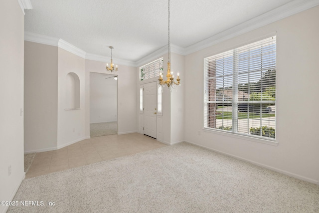 3384 Olympic Dr, Green Cove Springs, FL 32043 - carpeted spare room with a chandelier, healthy amount of natural light, baseboards, crown molding, and a textured ceiling
