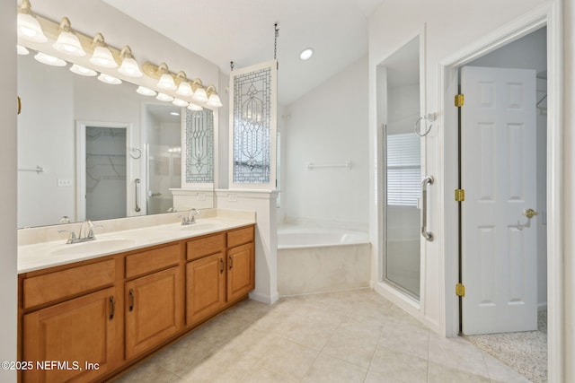 3384 Olympic Dr, Green Cove Springs, FL 32043 - bathroom with double vanity, a stall shower, a bath, tile patterned flooring, and a closet